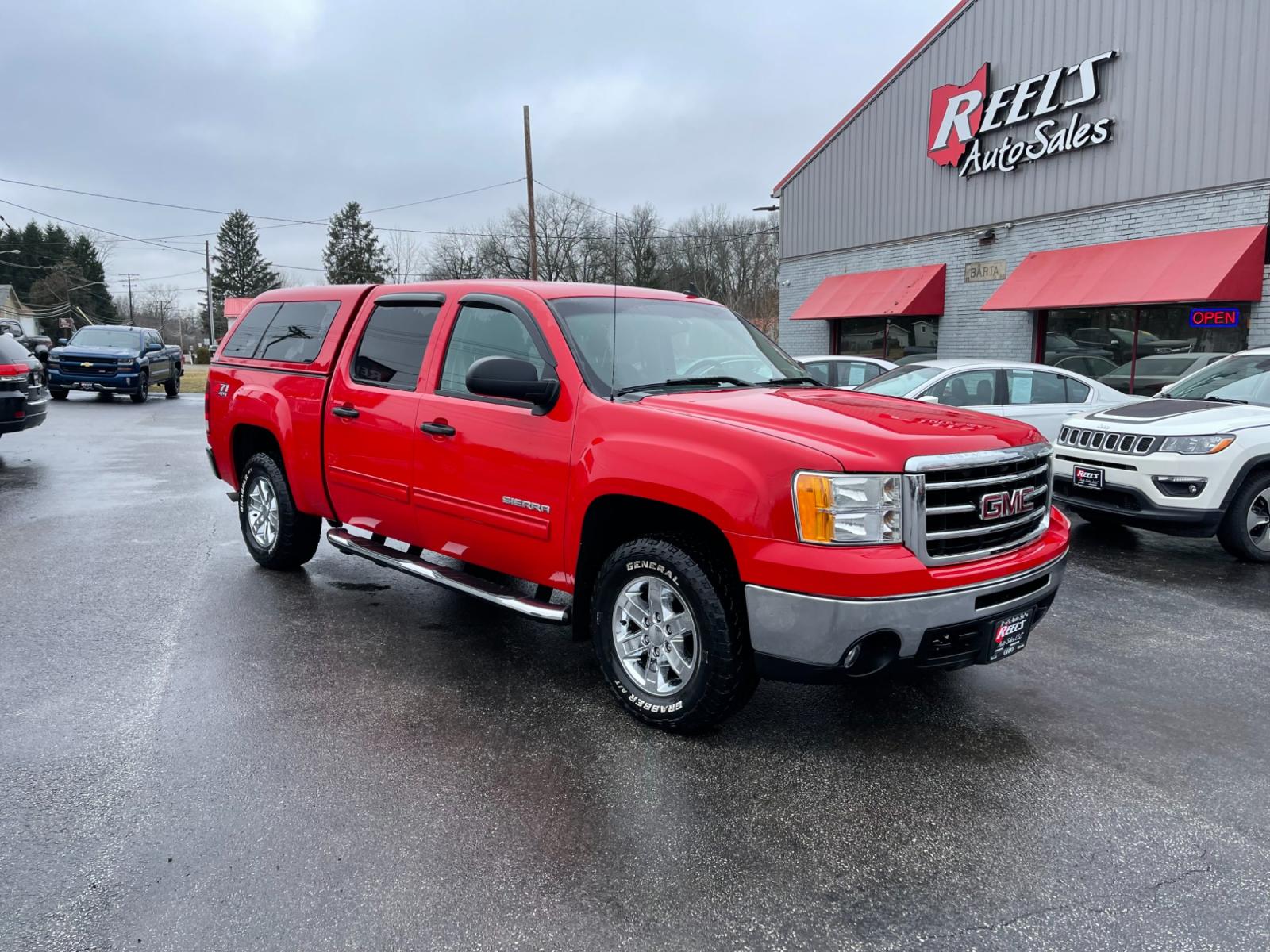2012 Red /Black GMC Sierra 1500 SLE Crew Cab 4WD (3GTP2VE78CG) with an 5.3L V8 OHV 16V FFV engine, 6-Speed Automatic transmission, located at 11115 Chardon Rd. , Chardon, OH, 44024, (440) 214-9705, 41.580246, -81.241943 - Photo #2